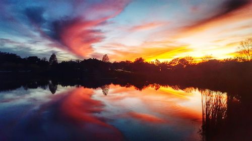 Scenic view of lake at sunset