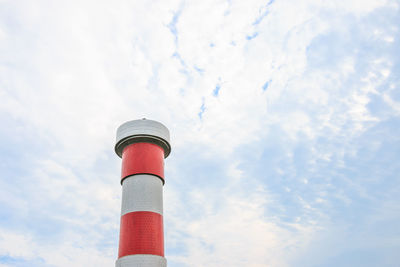 Low angle view of smoke stack against sky