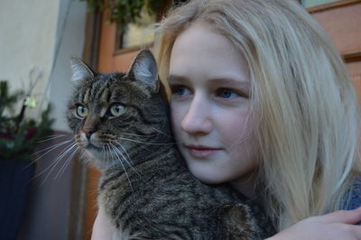 Close-up portrait of cat at home