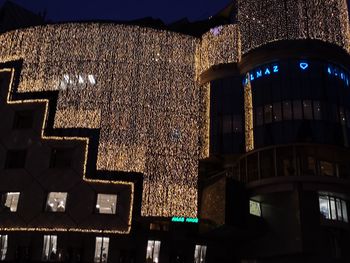 Low angle view of illuminated building at night