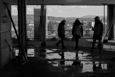 People at home against sky seen through window