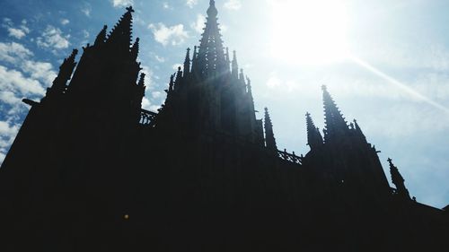 Low angle view of silhouette church against sky