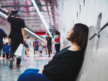 Side view of woman sitting