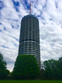 Low angle view of building against cloudy sky