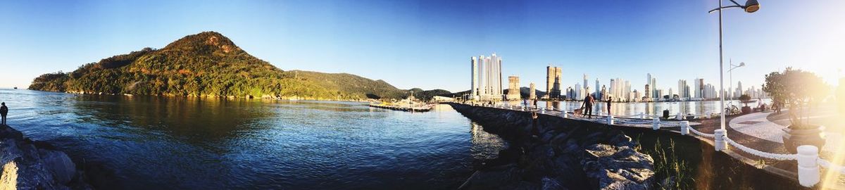 Panoramic view of sea against blue sky