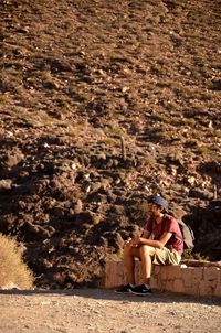 People relaxing on land