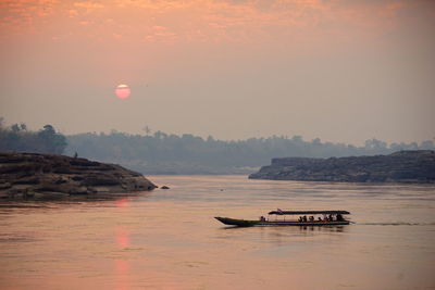 Scenic view of mekong river against sky during sunrise