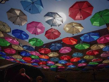 Low angle view of multi colored umbrellas