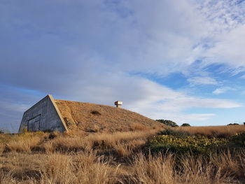 House on field against sky