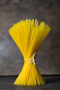 Close-up of raw spaghetti on table