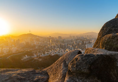 High angle view of city against sky during sunset