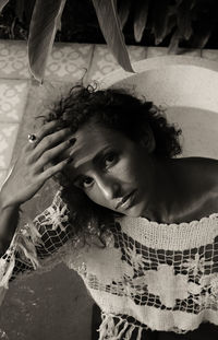 Portrait of young woman in bathtub