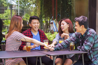 Young couple sitting at table