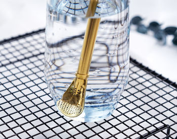 High angle view of drinking straw in jar on table