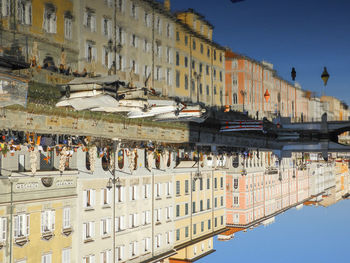 High angle view of buildings in town against sky