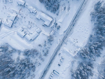 Aerial view of snow covered buildings in city