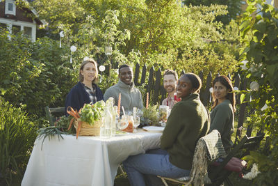 Friends having meal in garden