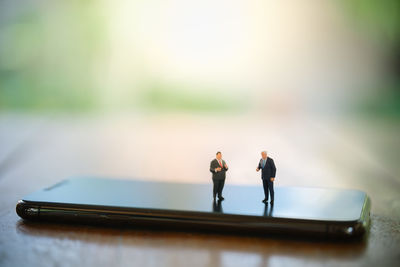 Man and woman standing on table
