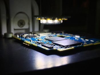 Close-up of illuminated lighting equipment on table