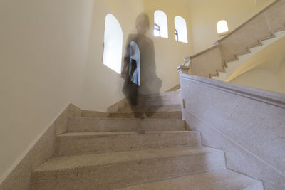 Low angle view of female ghost on steps