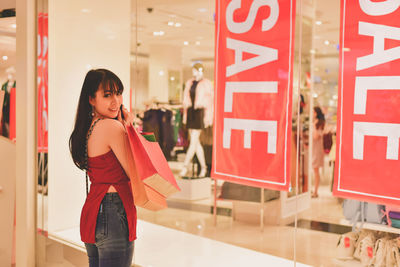 Young woman shopping in mall