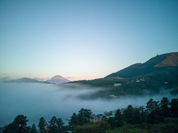 Scenic view of mountains against clear blue sky