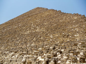 Low angle view of giza pyramid against clear sky