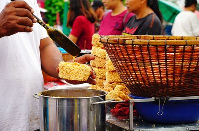 People having food at market stall