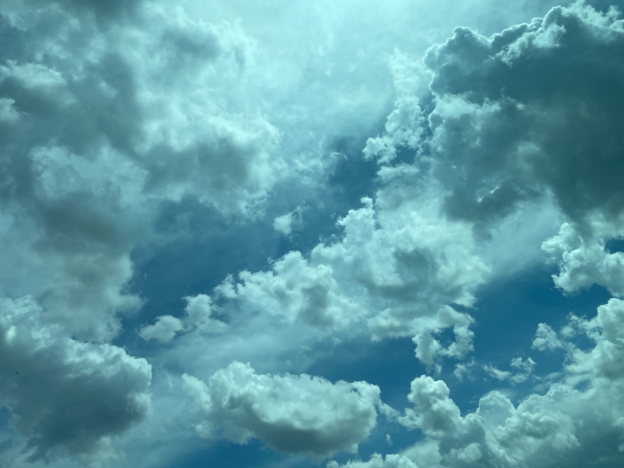 sky, cloud, daytime, cloudscape, backgrounds, nature, environment, dramatic sky, beauty in nature, overcast, blue, storm cloud, storm, no people, wind, scenics - nature, atmosphere, outdoors, fluffy, thunderstorm, idyllic, meteorology, sunlight, white, cumulonimbus, day, moody sky, tranquility, light - natural phenomenon, climate, wet, abstract