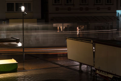 Blurred motion of illuminated railroad station in city