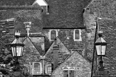 Low angle view of lantern against houses