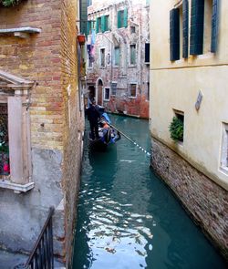 View of canal passing through buildings