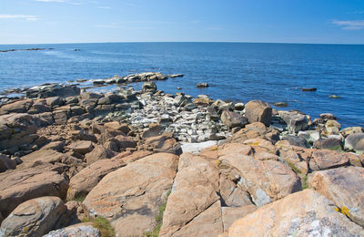 Scenic view of sea against blue sky