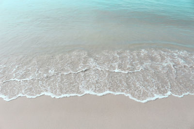 High angle view of waves on beach