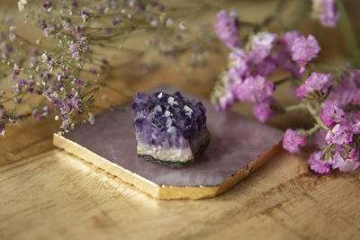 Close-up of purple roses on table