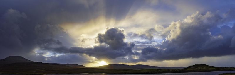 Panoramic view of storm clouds over mountains