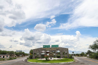 Road in city against sky