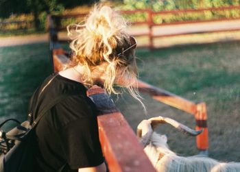 Side view of woman with arms raised