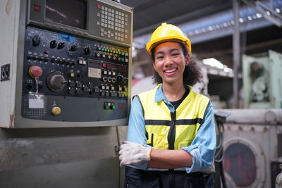 Portrait of young man standing in train