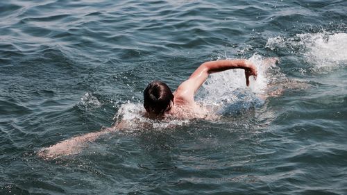 Man swimming in sea