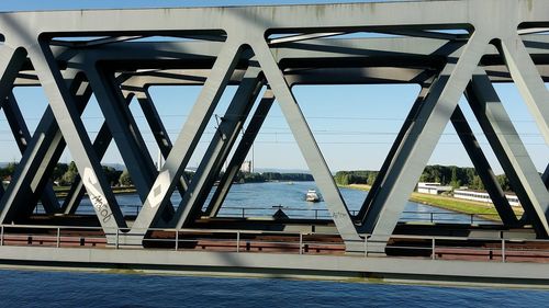 Bridge over sea against sky