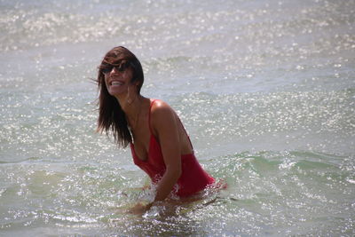 Beautiful young woman at beach