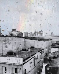 Buildings against sky during rainy season