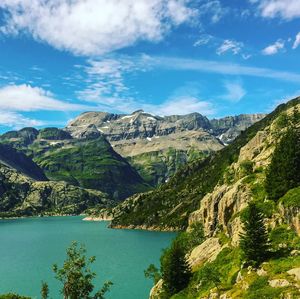 Scenic view of lake and mountains against sky