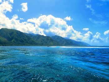 Scenic view of sea against blue sky