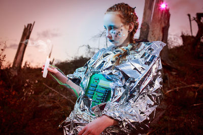 Close-up portrait of girl in space suit  