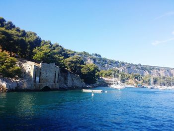 Scenic view of calm blue sea against clear sky