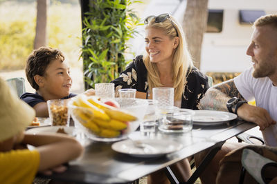 Family sitting at picnic table