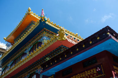 Low angle view of temple against blue sky