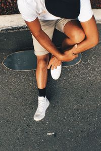 Low section of man standing outdoors